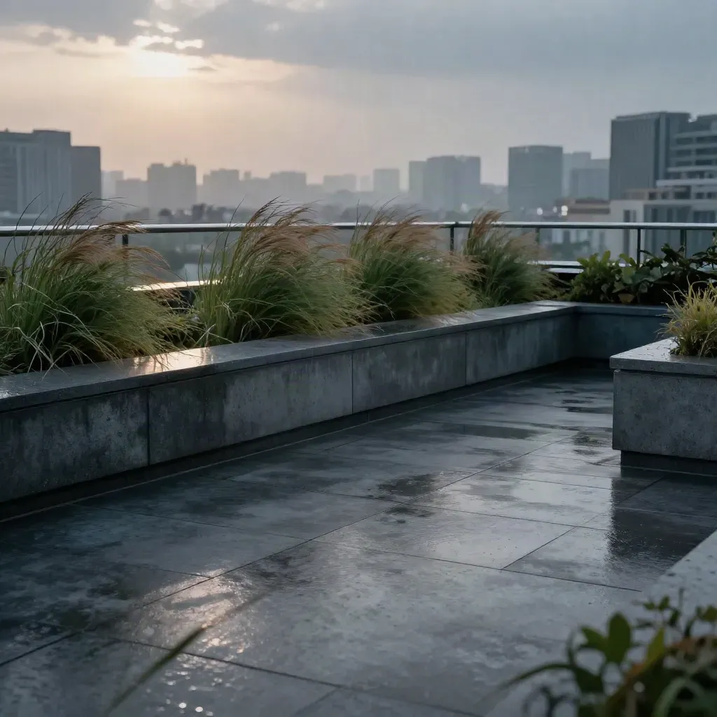 Blue-hour rooftop terrace with grasses, wet parapet, and distant towers in mist.